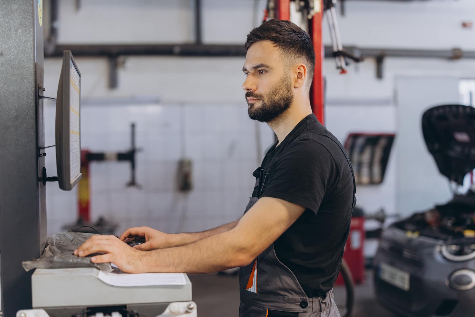 Mechanic logging service data into the manufacturer's database for a full vehicle check